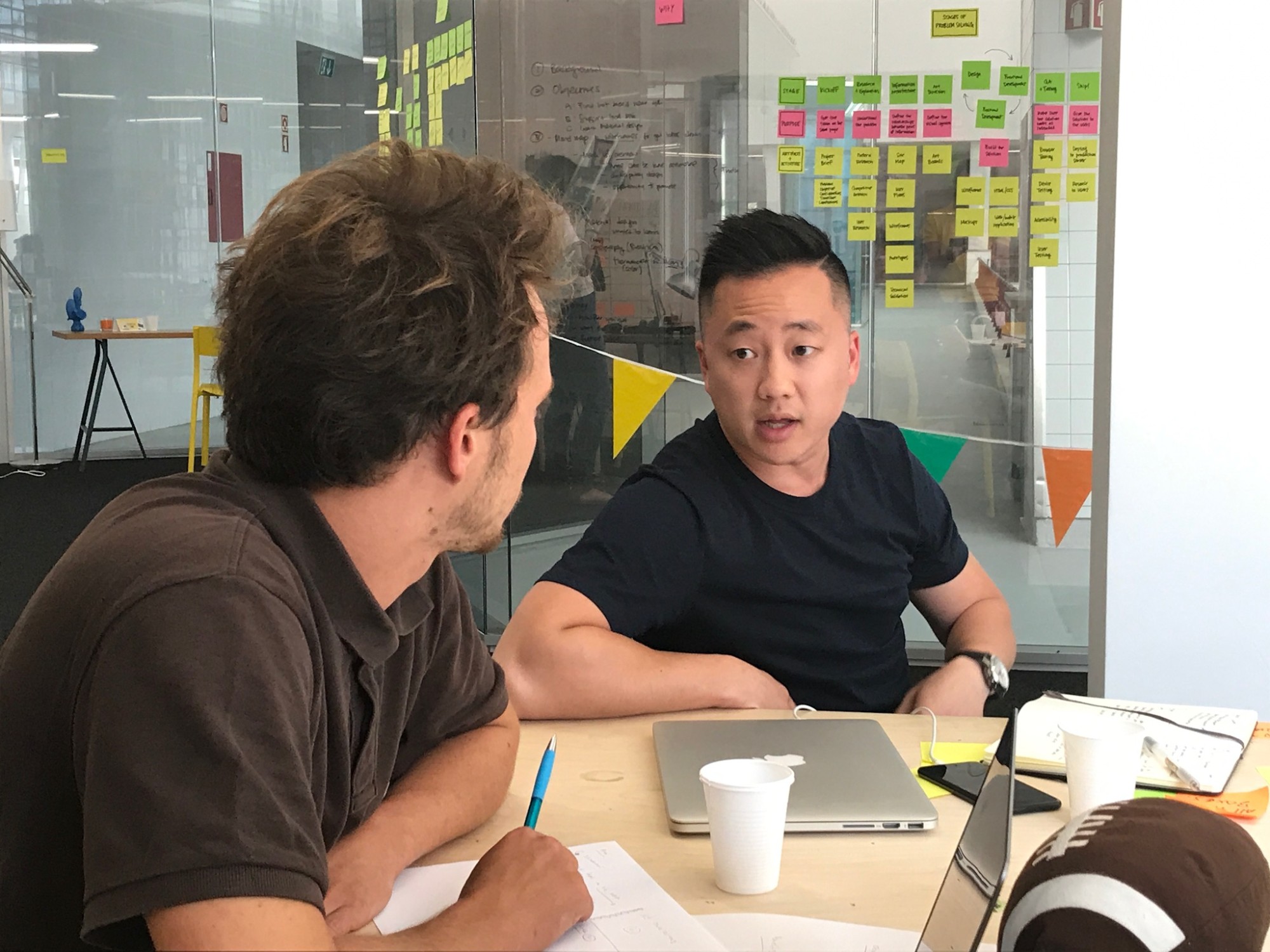 Verne Ho from Shopify in a one-to-one mentoring session with a student